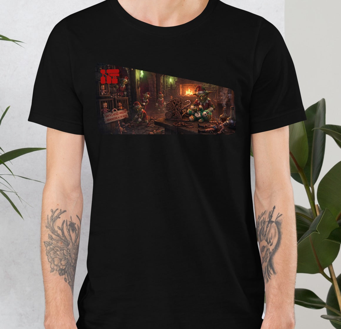 Santa's Wicked Workshop Unisex Tee, Black, model wearing shirt