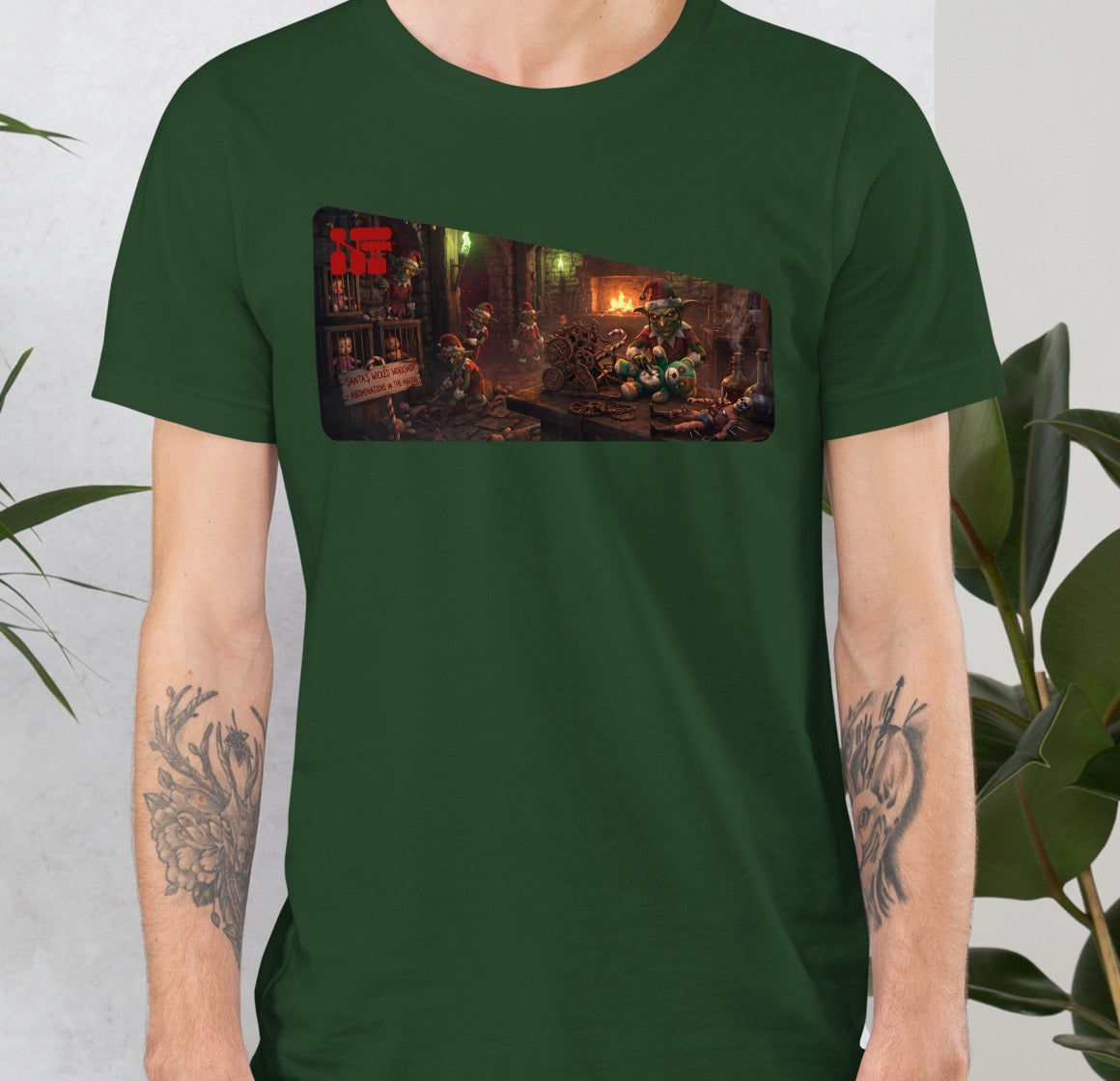 Santa's Wicked Workshop Unisex Tee, Forest, model wearing shirt